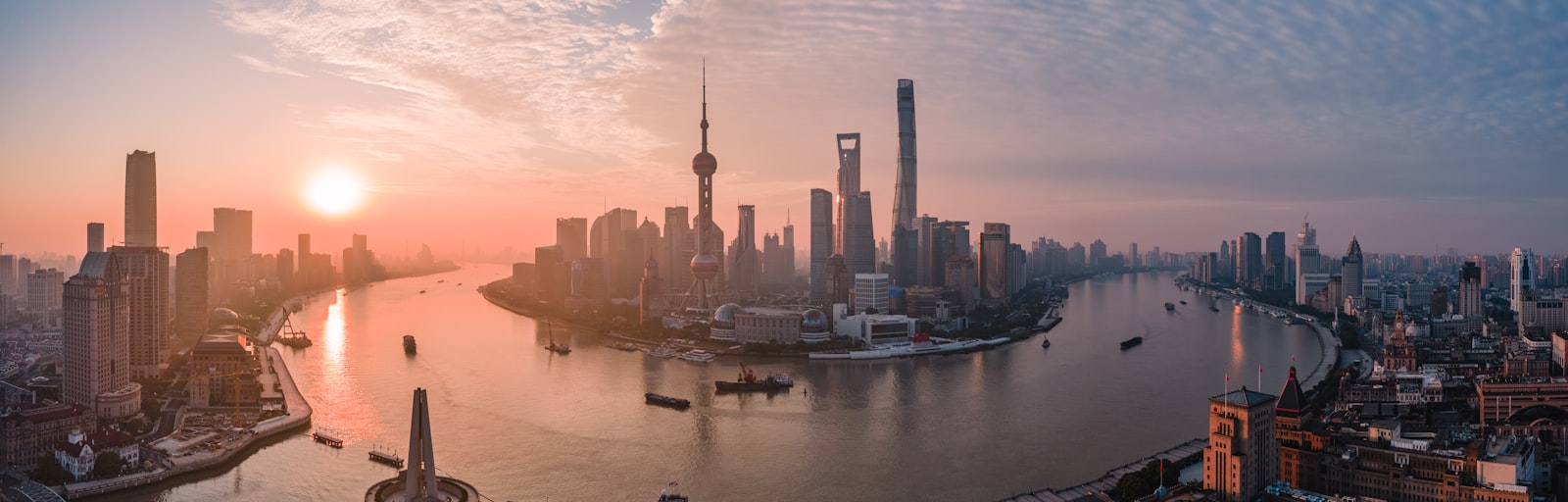 China cityscape with a busy container port beyond