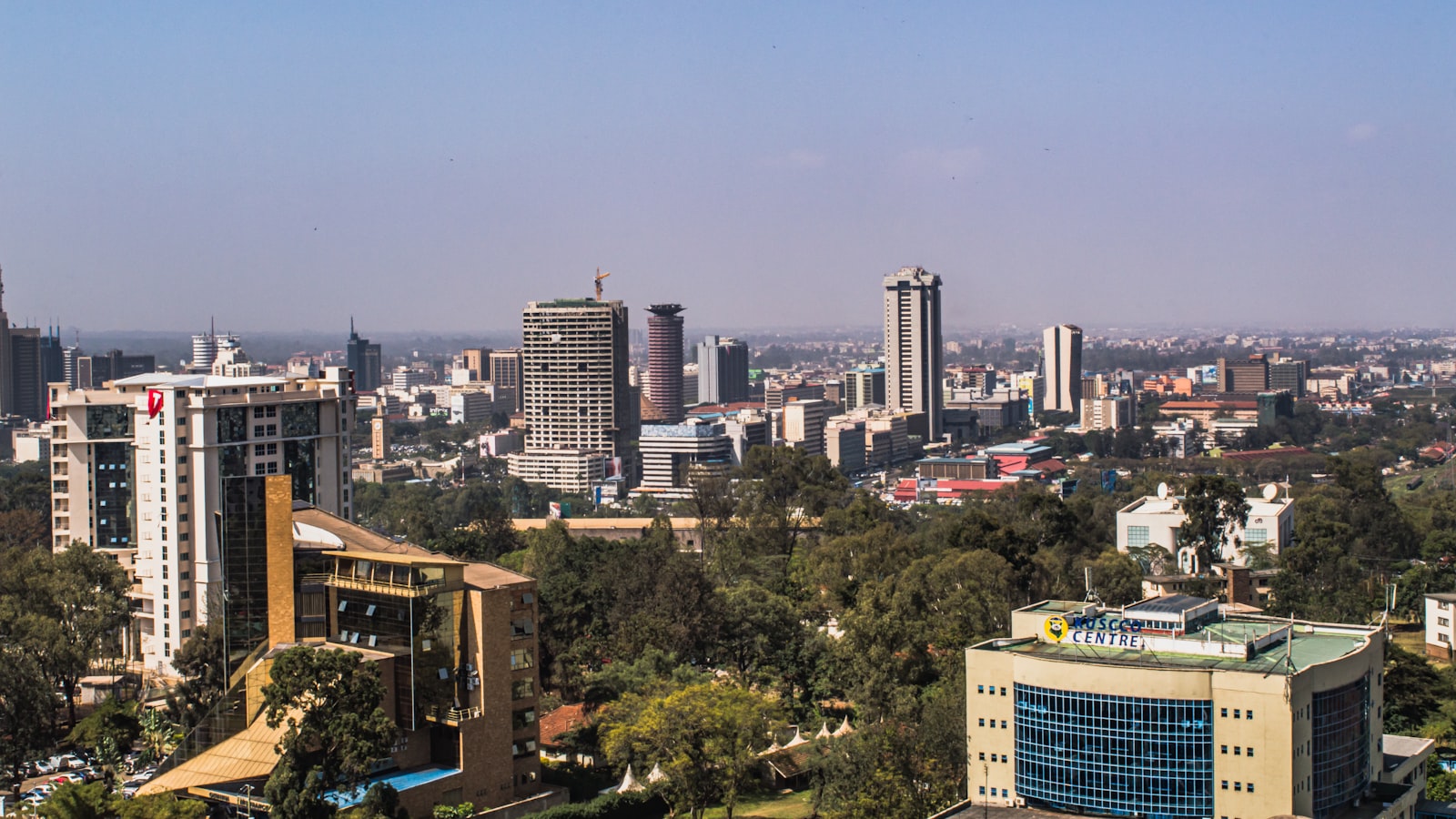 The Nairobi skyline at dusk with city towers against a wide East African sky